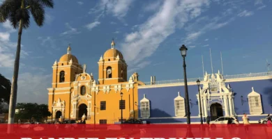 imágen de la catedral de trujillo con la palabra banbif en letras blancas y el logo de la web