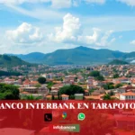 imágen de la ciudad de tarapoto con la palabra interbank, iconos de contacto y el nombre de la web.